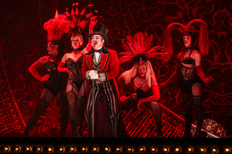 Robert Petkoff as Harold Zidler and the cast of the North American Tour of Moulin Rouge! The Musical, Photo by Matthew Murphy and Evan Zimmerman for MurphyMade